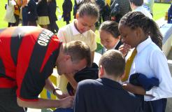 Clive signs some autographs.